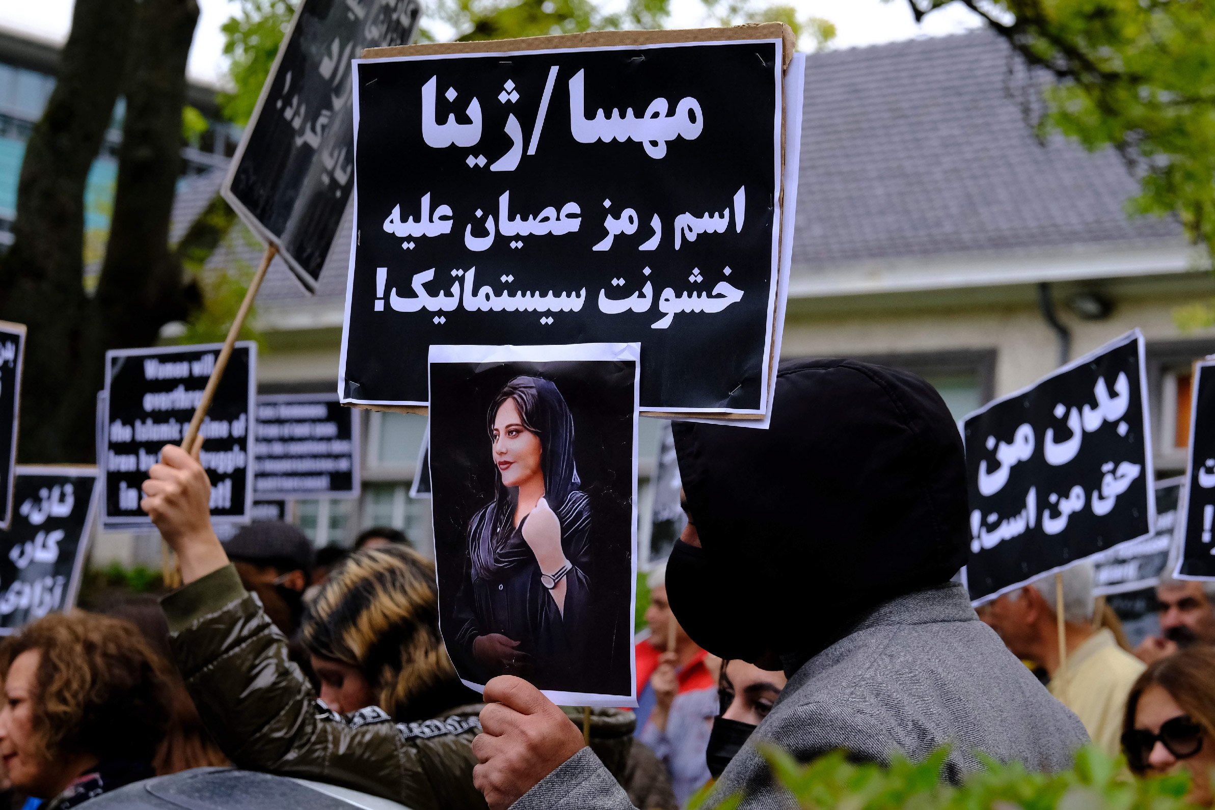 Protestors take part during a demonstration in front of the Iranian embassy in Brussels, Belgium, following the death of Mahsa Amini